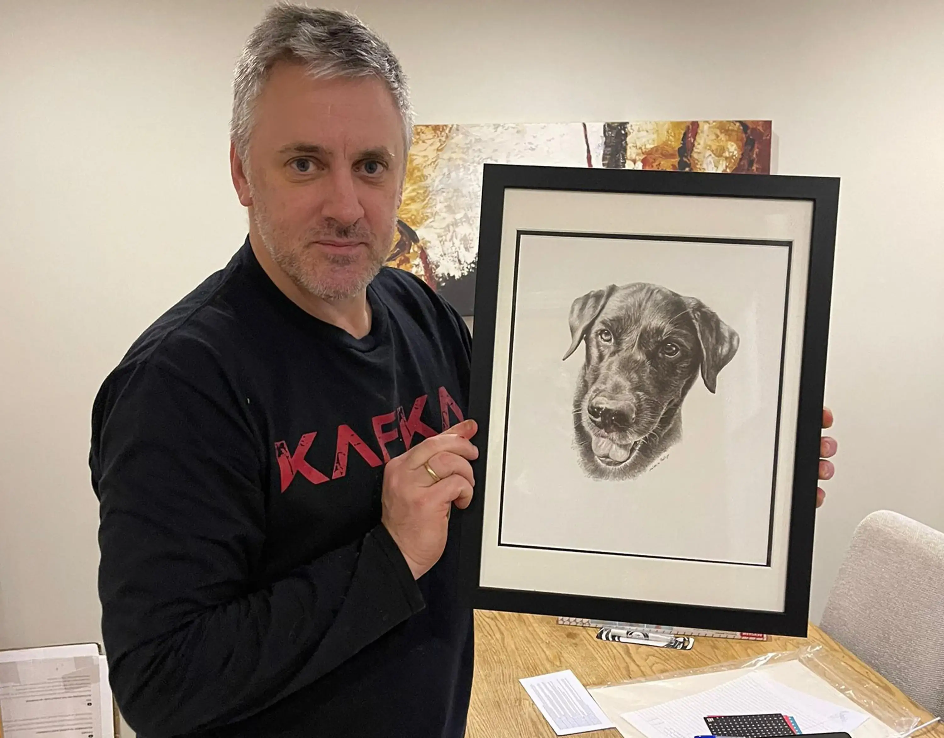 Melanie Phillips with a pencil drawing of a dog, highlighting the classic drawing style.