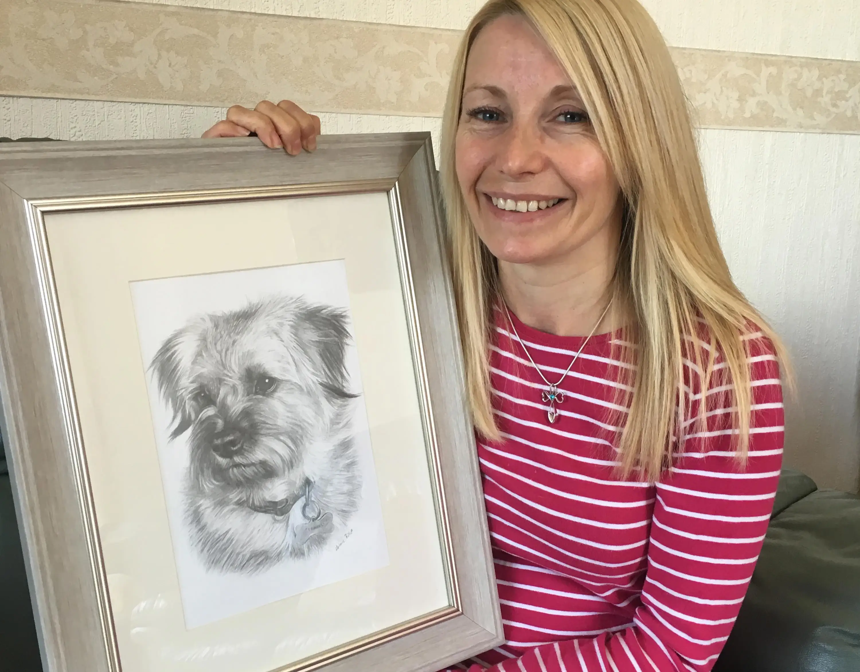 Close-up of a classic pencil drawing of dogs by Melanie Phillips, highlighting intricate detail.