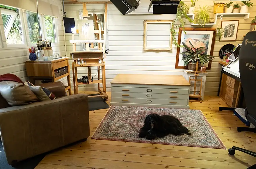 Client seating area and vintage plan chest