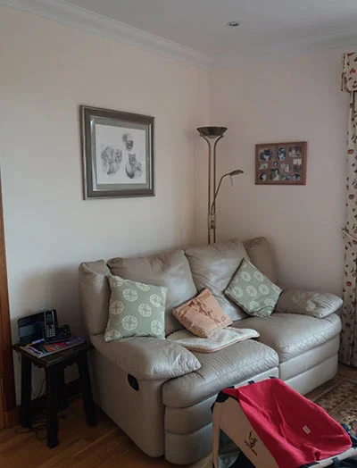 A beautifully framed pencil portrait of a cat, complemented by a sage green mount, appreciated by client Kirstie.