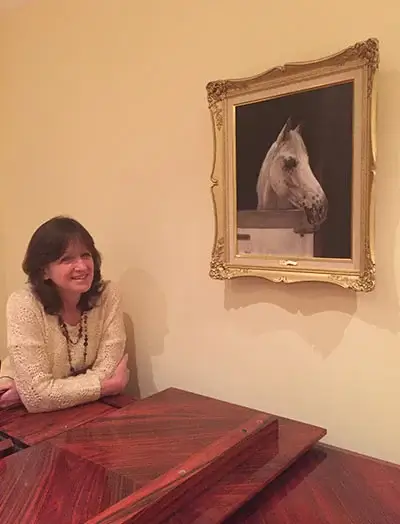 A newly completed horse portrait displayed in a home, with a client expressing their mum's love for the painting.