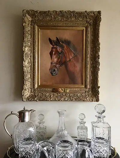 A client unpacking and admiring a stunning new pet portrait, expressing delight at its quality.