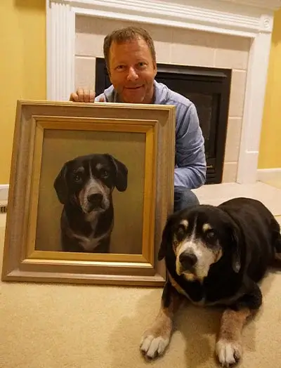 Bob and Lance, a happy couple, posing with their new pet portrait of their dogs, celebrating their wedding day.