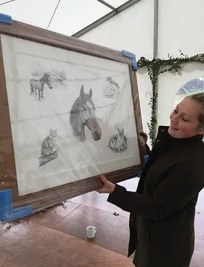 Annabel receiving her cherished pet portrait, presented by Mr and Mrs Archer.