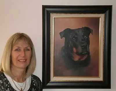 Sharon Eggers with her magnificent portrait of Tobi, her beloved Rottweiler, created as a birthday gift after Tobi's passing.
