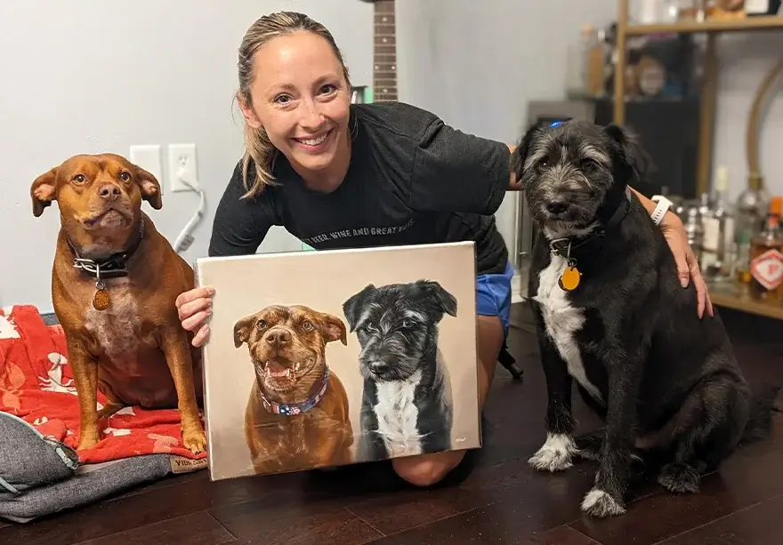 Brian's family with Jen, showing dogs Moose and Shadow with their custom oil portrait, displaying emotional satisfaction with the artwork