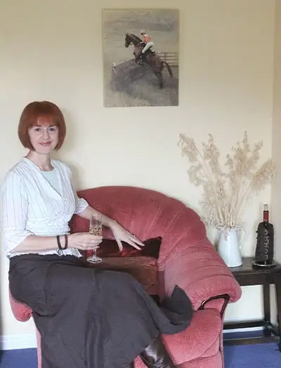 A beautiful equestrian portrait of Frisbee, a horse and rider, admired for its composition and muted background by client Lynne.